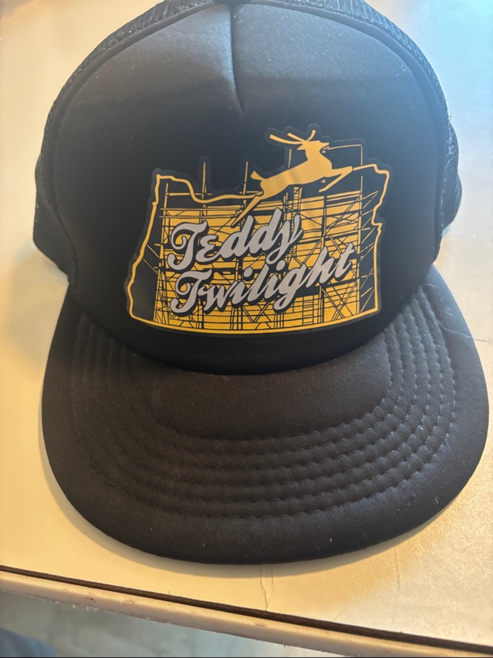 District Black Trucker Hat with Yellow Teddy Twilight Graphic